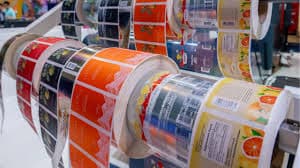 Labelled product rolls on a manufacturing line